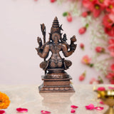 Front view copper-tone goddess sculpture with multiple arms, detailed crown and jewelry