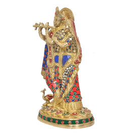 Standing brass Radha Krishna idol with colorful jeweled trim and patterned garments
