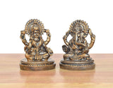 Lakshmi and Ganesh sitting resin murtis in gold tone, front view on round bases