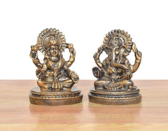 Lakshmi and Ganesh sitting resin murtis in gold tone, front view on round bases