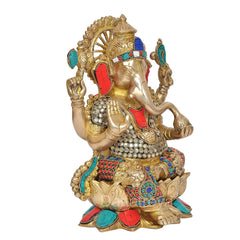 Side view brass Ganesha statue with colorful jeweled ornaments on body and crown