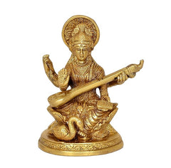 Gold-tone brass Saraswati playing veena, seated with ornate detailing