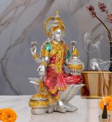 Lakshmi resin statue on lotus, teal and red attire, gold halo, seated pose