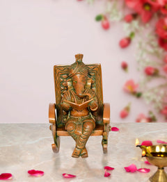 Brass Ganesha statue: turbaned Ganesh reading, seated on chair, front view