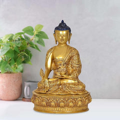 Gold-tone seated Buddha idol statue with blue jeweled crown and ornate round base