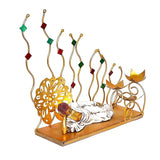 Metal reclining Buddha table showpiece with gold figure, red/green decorative stem details