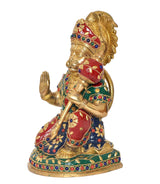 Brass Hanuman sitting statue in profile, colorful jeweled garment and crown
