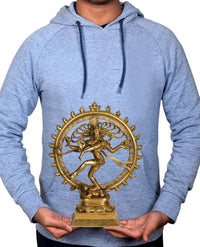 Brass Nataraja Shiva idol statue graphic on light blue hoodie, held by hands