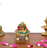 Multicolor brass Ganesha statue from front view, seated on ornate golden base