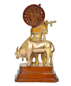 Brass Krishna with cow idol, back/side view, flute and embossed halo disk