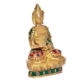 Seated brass Buddha statue with ornate jeweled clothing, hands in lap, lotus base, 7.5 in.
