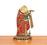 Angled view of Radha Krishna brass statue on a round decorated pedestal