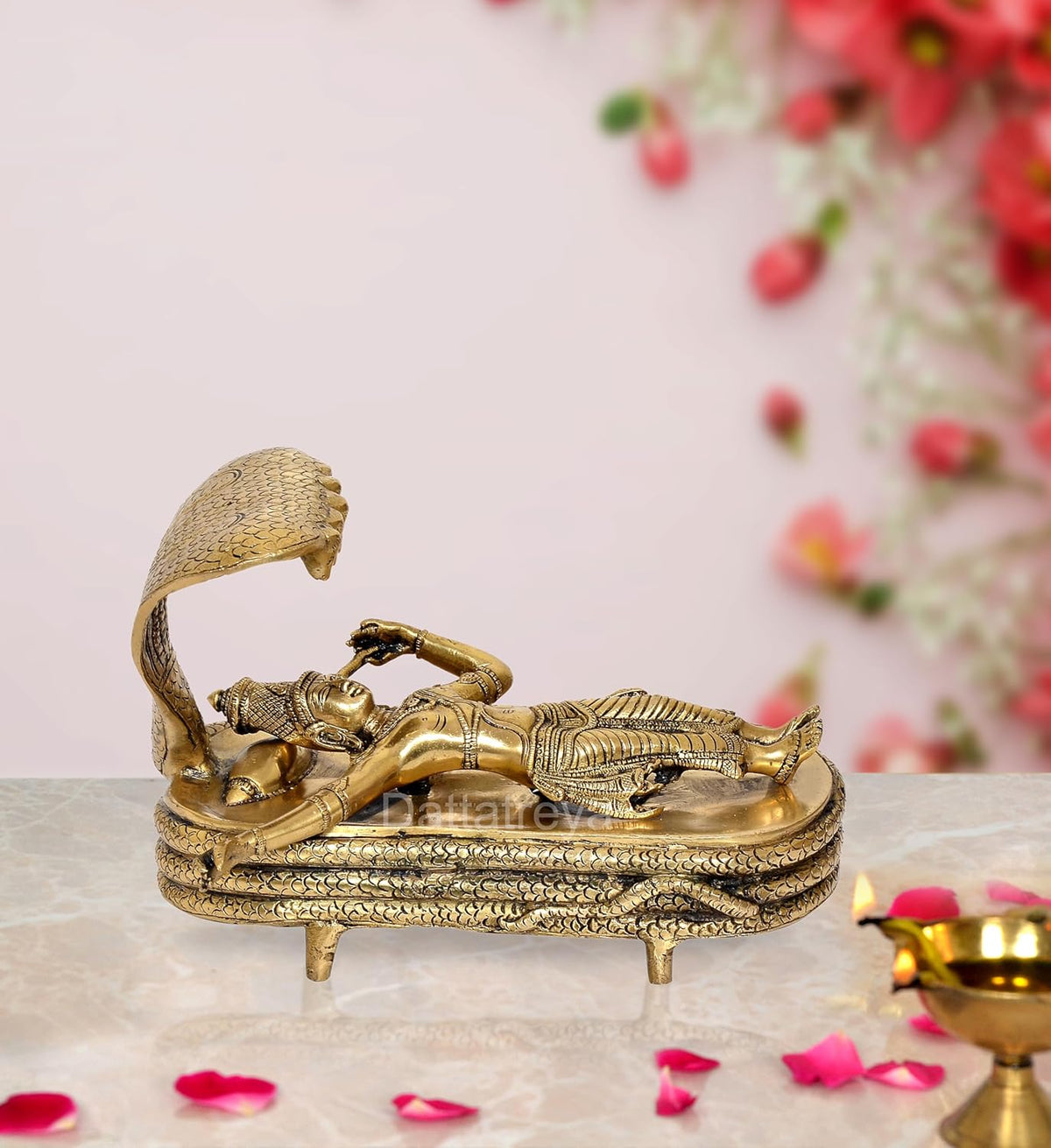 Brass Vishnu Yoga Nidra statue, reclining on ornate platform with cobra hood
