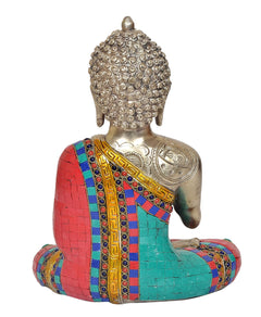 Brass Buddha statue, rear view with detailed crown and seated mosaic robe