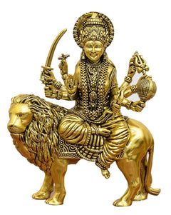 Golden brass Durga Maa idol riding a lion, detailed jewelry and weapons