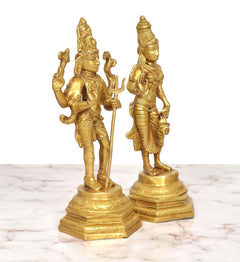 Brass Shiva and Parvati standing figurines, close view of faces and hands