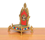 Brass pooja chowki side view, colorful stripe base and decorated arch with deity symbol
