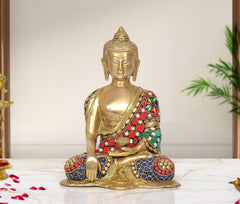 Brass Buddha statue, front view, seated with multicolor jeweled robe and hand gesture