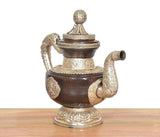 Brass Himalayan teapot with rounded lid finial, curled spouts, embossed oval motifs