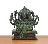 Brass Ganesha idol with Riddhi and Siddhi figures, seated posture, green-bronze finish