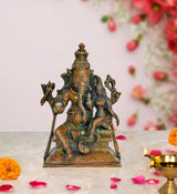 Brass Ganesha statue with Siddhi idol, seated on ornate base, front view