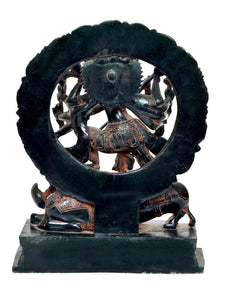 Back view of brass Durga Maa statue with circular halo and lion figures at base