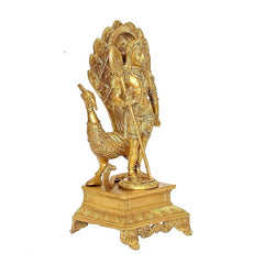 Brass Murugan-Kartikeya idol, side view with raised spear and layered ornate base