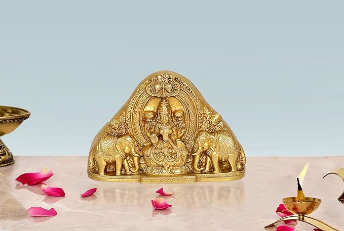 Brass Lakshmi idol sitting statue with elephants, ornate temple-style base