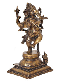 Dancing Ganesha brass statue with raised handholds, angled view