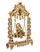 Brass Ganesha swing statue with detailed multicolor frame and hanging bell chains