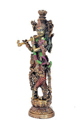 Krishna statue side view, ornate crown and jewelry, flute held across body