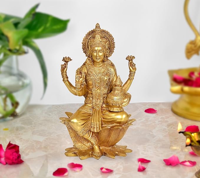 Brass Lakshmi statue idol seated on lotus with four arms and ornate crown