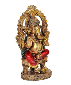 Resin Ganesha idol, seated on pedestal, red dhoti, green accents, gold ornamentation