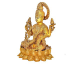 Brass Lakshmi idol side view, serene face, four arms, ornate lotus pedestal