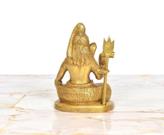 Lord Shiva brass sculpture back view, seated in blessing pose with trident