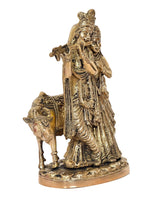 Brass Radha-Krishna idol with cow, close side view, crowned Radha and Krishna figures
