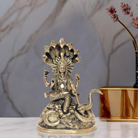 Brass Vishnu statue seated on Sheshanaga, ornate crown and four arms, 8 inch