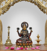 Lakshmi Brass Idol, seated with four arms and lotus base