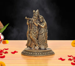 Brass Radha Krishna idol: Radha beside Krishna playing flute, on round base (3 inch)
