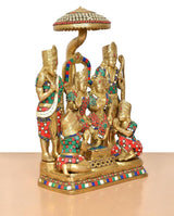 Brass Ram Darbar statue side view: central seated deity and flanking figures under canopy
