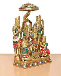 Brass Ram Darbar statue side view: central seated deity and flanking figures under canopy
