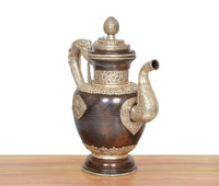 Dark brown brass teapot with two side grips, ornate banded neck, and domed lid knob