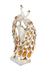 Resin peacock couple sculpture, full view of two birds with gold decorative feather spots