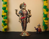 Brass Dhanvantari idol with red-green stonework, one hand raised in blessing
