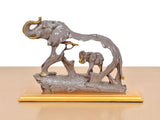 Resin elephant holding baby elephant, gray figurine on gold base