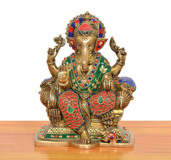 Brass Ganesha statue seated on singhasan with jeweled multicolor attire and hands raised