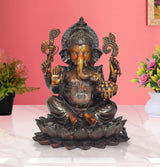 Brass Ganesha sitting on lotus, brown and gold, four arms with offerings