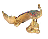 Brass peacock showpiece side view with mosaic tail and carved foot base