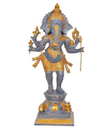 Brass six-armed standing Ganesha idol with gold ornaments and raised hands, 27 in