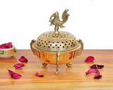 Golden brass loban dhoop dani with peacock ornament and dome perforations